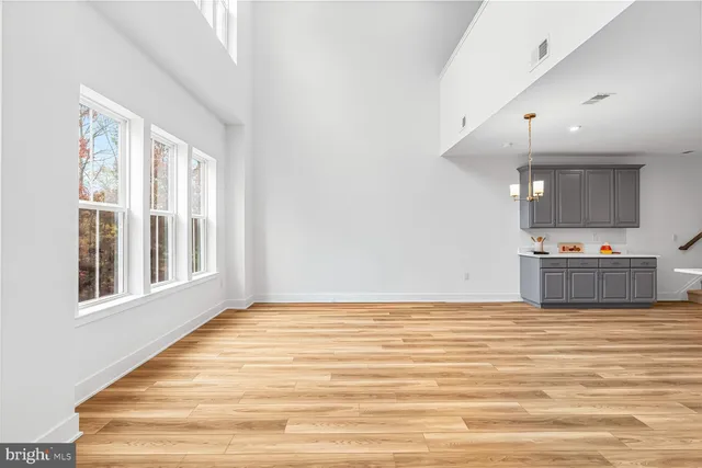 a view of a kitchen with a sink and cabinets