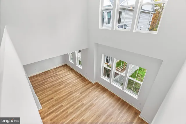 a view of an entryway with wooden floor