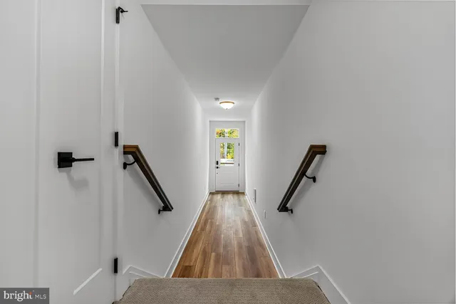 a view of entryway with wooden floor