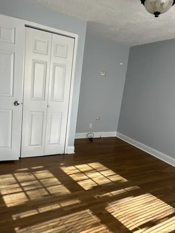 a view of a livingroom with wooden floor