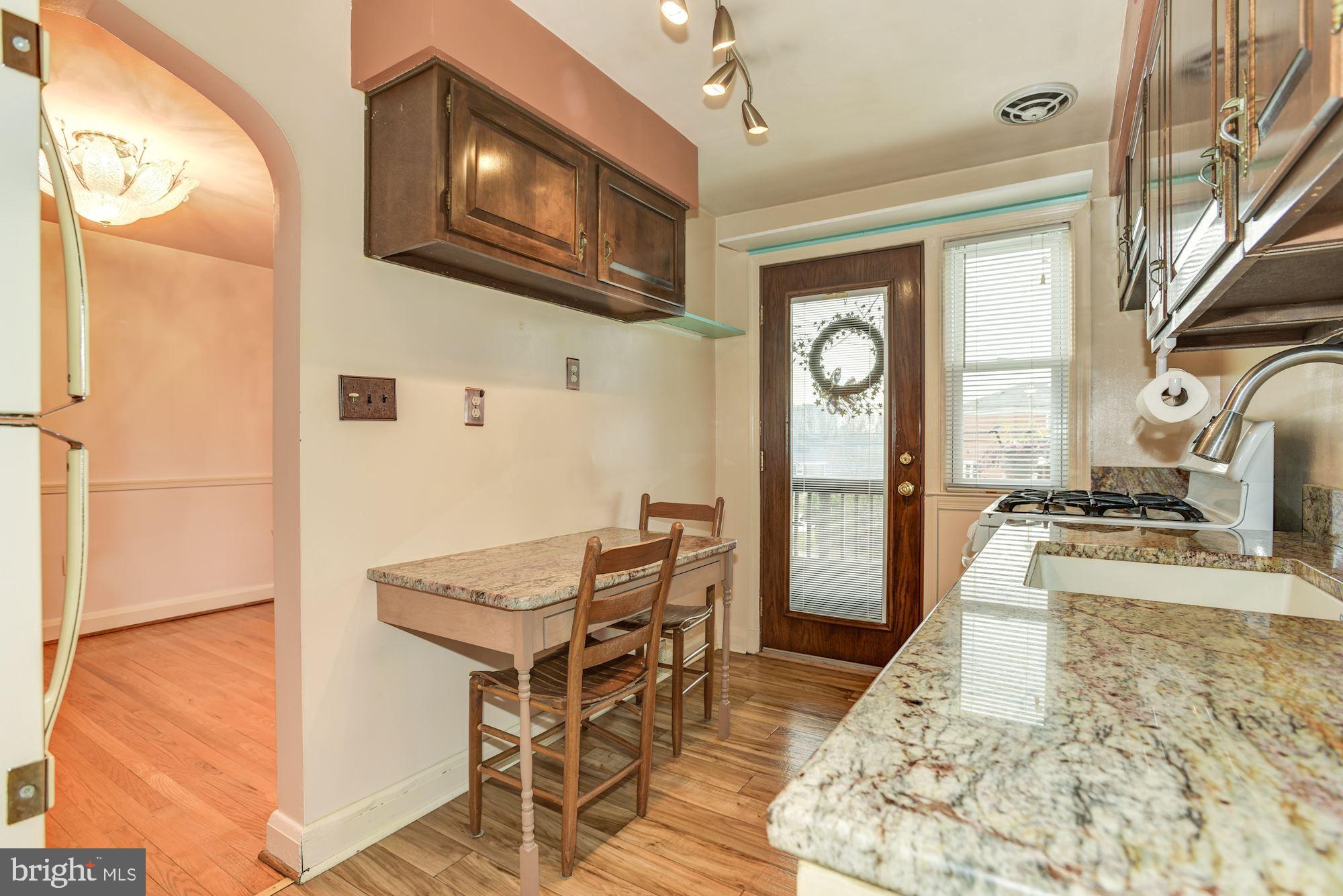 1041 Downton Road Baltimore, MD 21227 - Photo 14 of 40 Remodeled kitchen with built in cafe table
