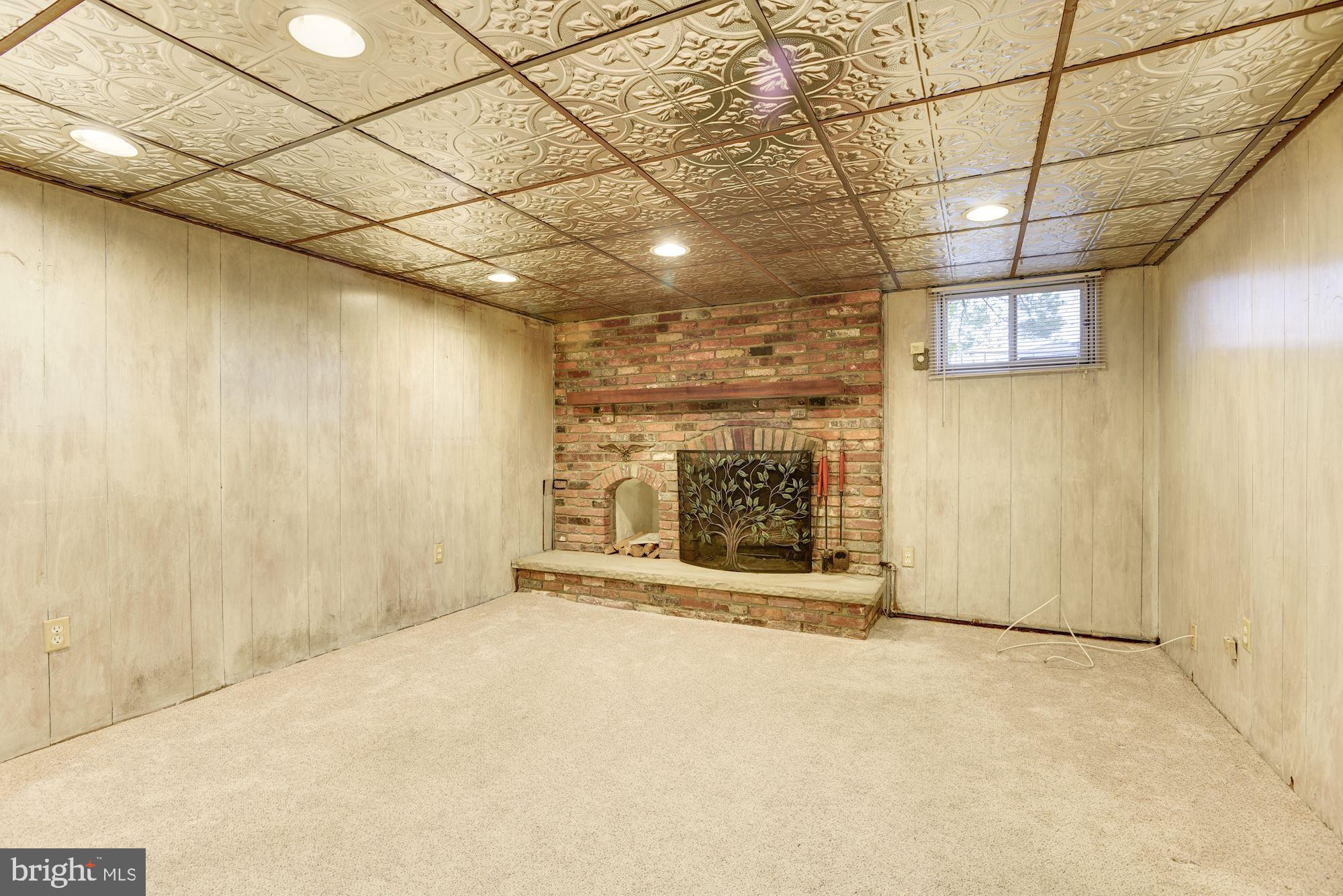 1041 Downton Road Baltimore, MD 21227 - Photo 28 of 40 Brick profile fireplace & recessed lighting