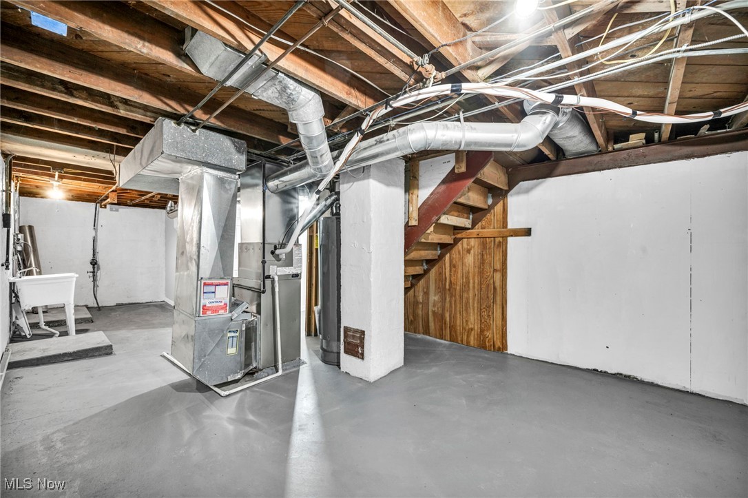 1682 Overbrook Road Lyndhurst, OH 44124 - Photo 25 of 33 Unfinished basement with stairway, heating unit, and water heater
