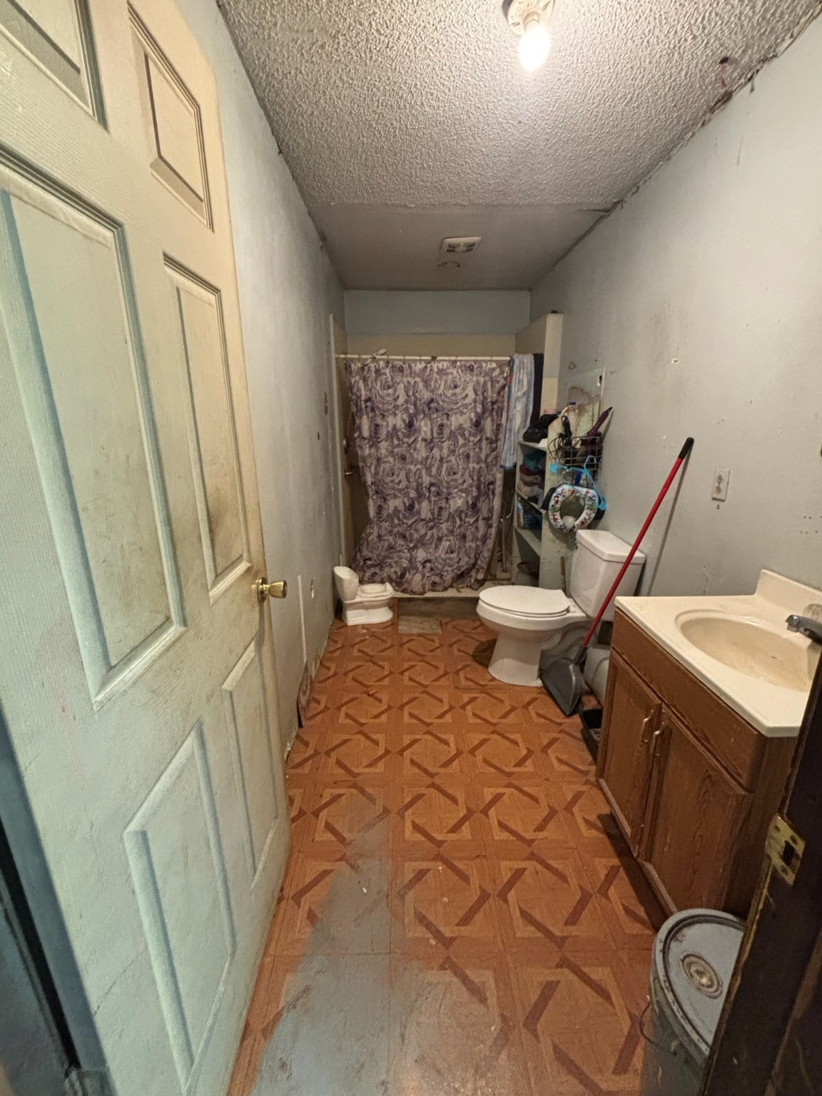 901 Rose Street Merkel, TX 79536 - Photo 8 of 10 a bathroom with a sink and toilet