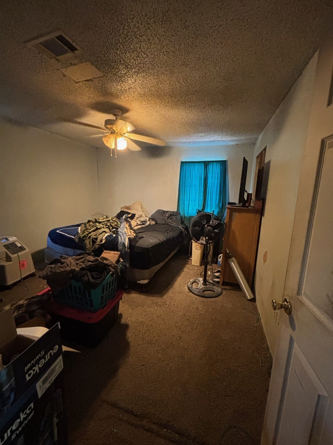 901 Rose Street Merkel, TX 79536 - Photo 9 of 10 a bed sitting in a room next to a window