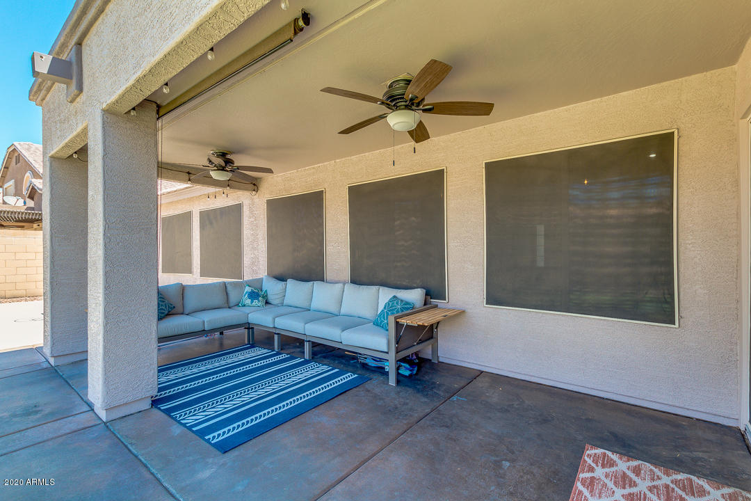 3788 South Martingale Road Gilbert, AZ 85297 - Photo 33 of 46 a living room with furniture and a window