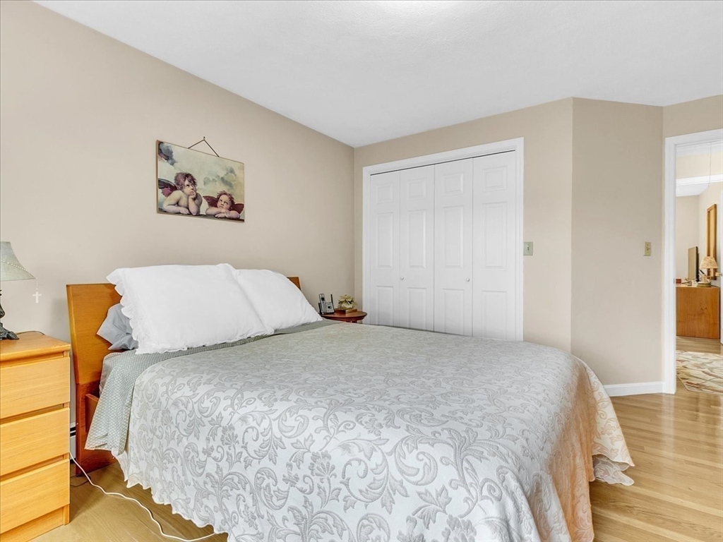 51 Walnut Street Saugus, MA 01906 - Photo 12 of 42 a bedroom with a bed and a painting on the wall