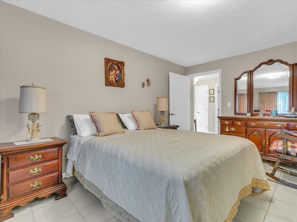 51 Walnut Street Saugus, MA 01906 - Photo 14 of 42 a bedroom with a bed and a dresser