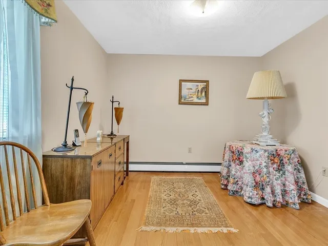 a couple of table and chairs in front of house