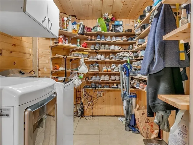 a view of a house with backyard and a street