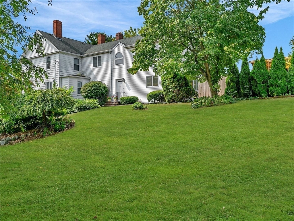 51 Walnut Street Saugus, MA 01906 - Photo 20 of 42 a front view of a house with a garden