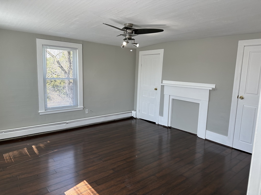 51 Walnut Street Saugus, MA 01906 - Photo 32 of 42 a view of an empty room with wooden floor and a window