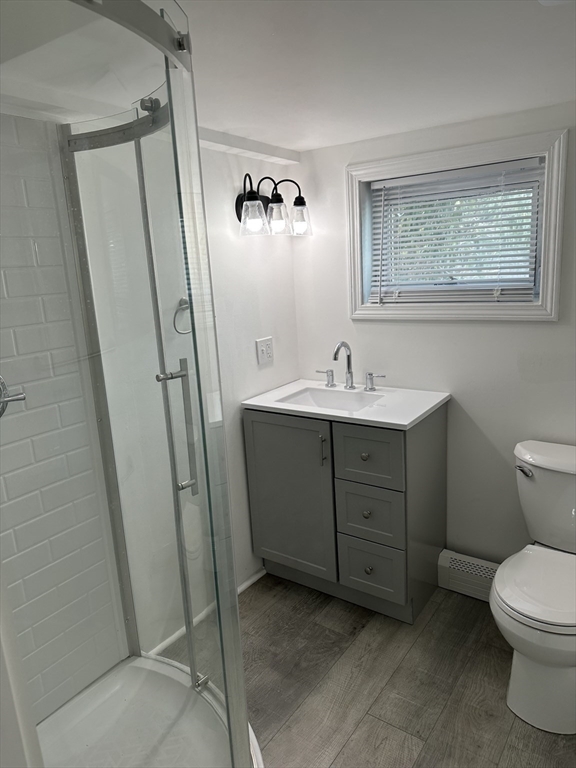 51 Walnut Street Saugus, MA 01906 - Photo 38 of 42 a bathroom with a sink a toilet and a mirror