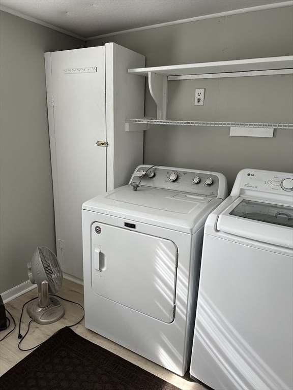 51 Walnut Street Saugus, MA 01906 - Photo 39 of 42 a utility room with dryer and washer