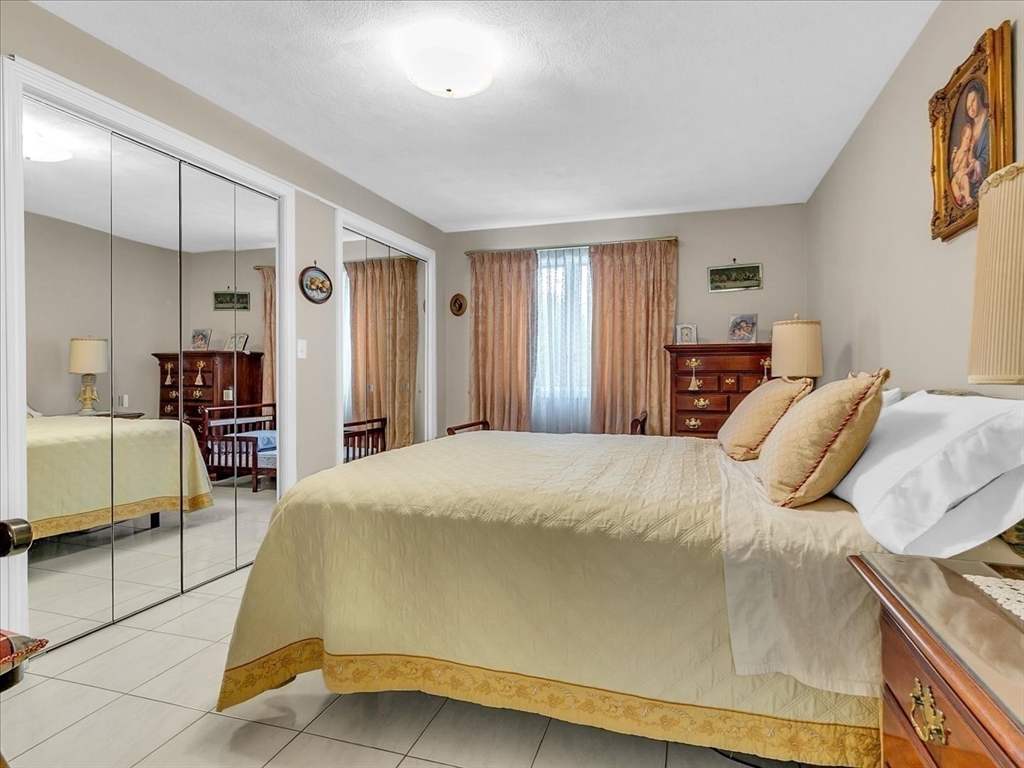 51 Walnut Street Saugus, MA 01906 - Photo 5 of 42 a bedroom with a bed and a couch