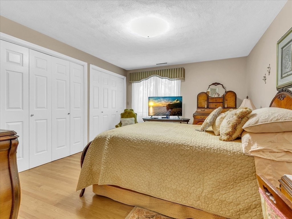 51 Walnut Street Saugus, MA 01906 - Photo 8 of 42 a bedroom with a bed and a painting on the wall