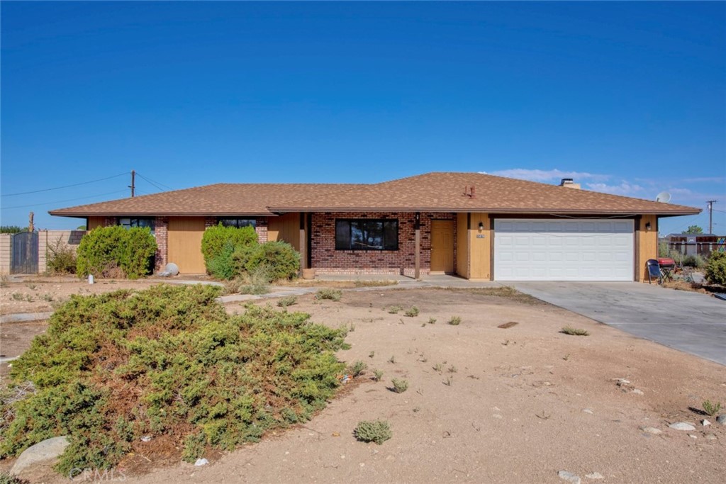 15070 Flathead Road Apple Valley, CA 92307 - Photo 1 of 1 a front view of a house with garden