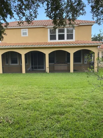 a front view of a house with yard and garage