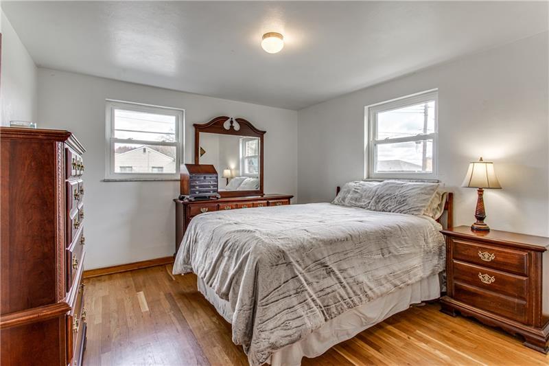 3401 McRoberts Road Pittsburgh, PA 15234 - Photo 13 of 21 Second bedroom with wood floors and two windows and plenty of room for a king bed and more.