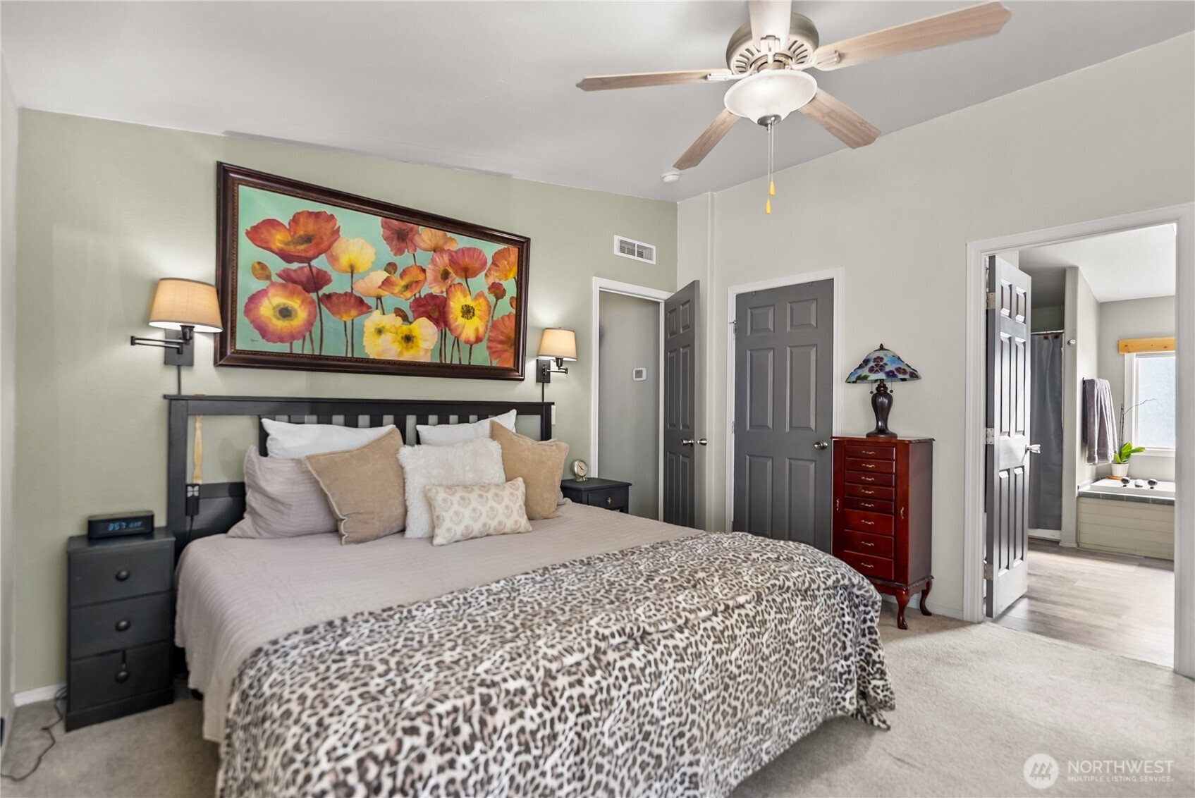 24 Lookout Trail Riverside, WA 98849 - Photo 15 of 39 a bedroom with a large bed and a chandelier