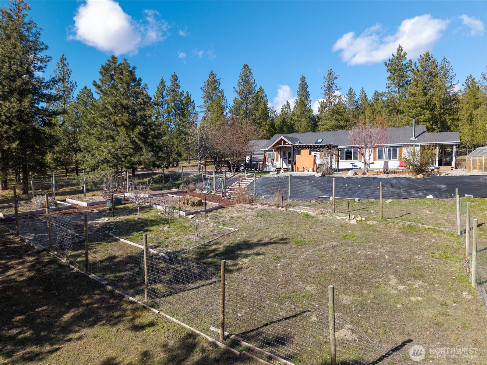 24 Lookout Trail Riverside, WA 98849 - Photo 37 of 39 a view of a swimming pool with a patio and a yard