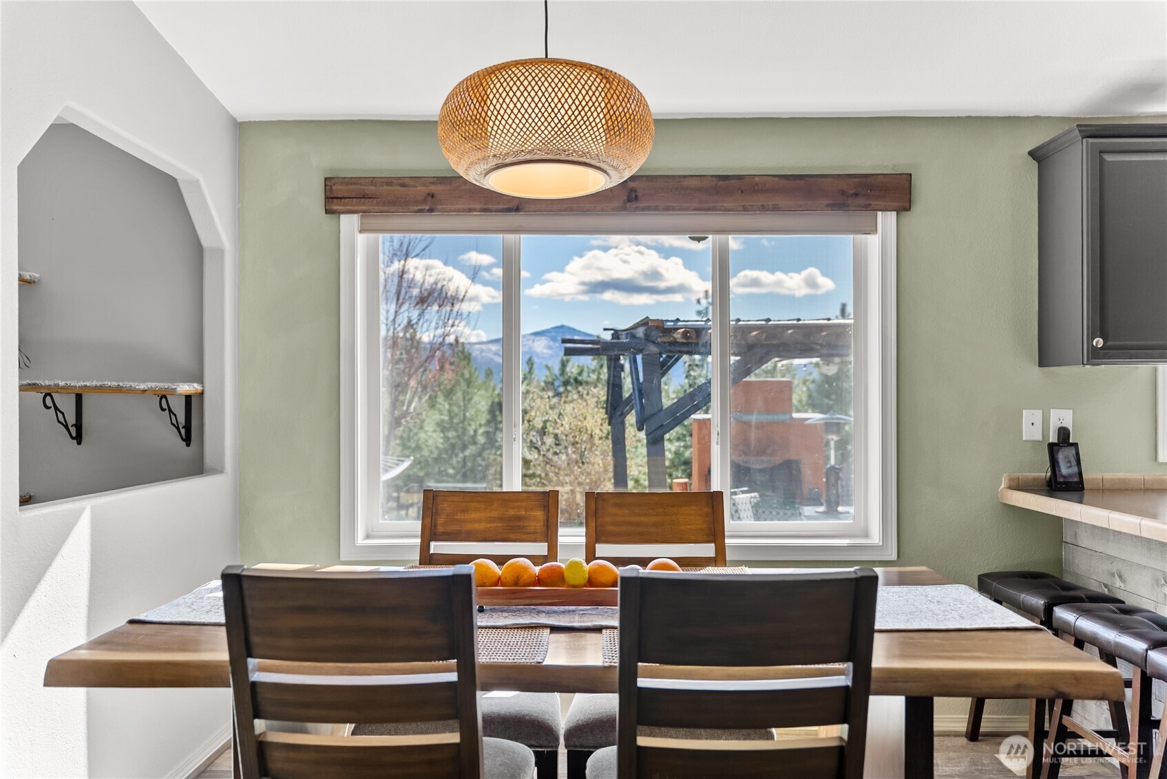 24 Lookout Trail Riverside, WA 98849 - Photo 7 of 39 a view of a dining room with furniture wooden floor and a large window