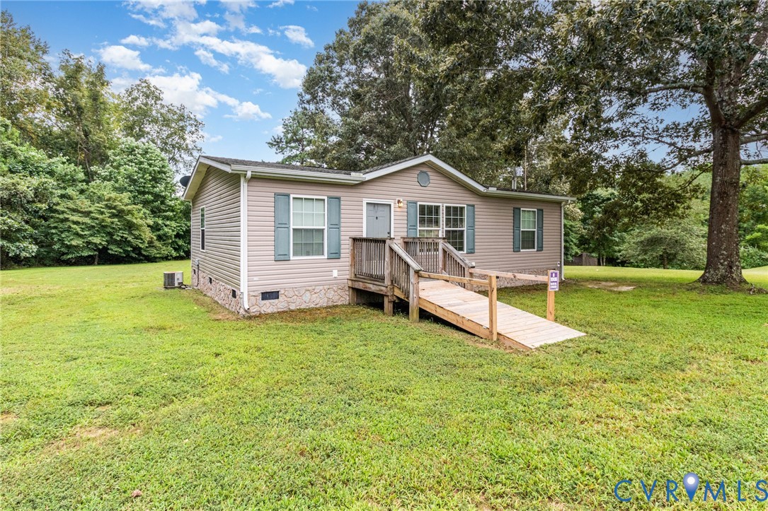 1292 Mt Prospect Road Laneview, VA 22504 - Photo 2 of 25 a view of a house with a yard patio and a tree
