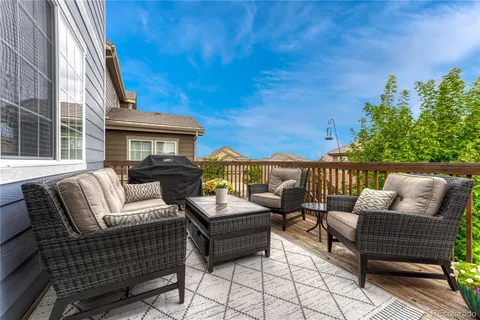a view of a patio with couches and pool