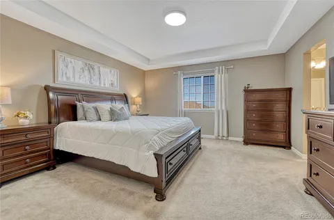 a bedroom with a bed and cabinets
