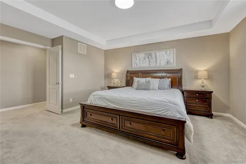 a bedroom with a bed and dresser