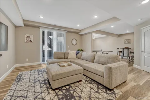 a living room with furniture and a rug