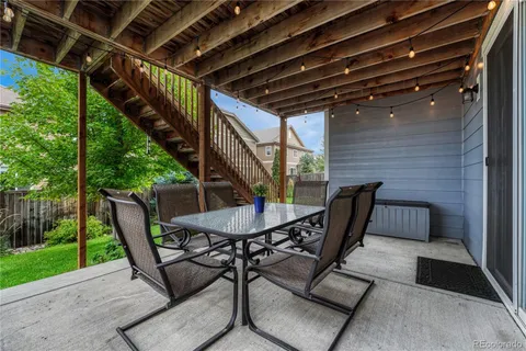 a view of an outdoor sitting area with furniture and garden