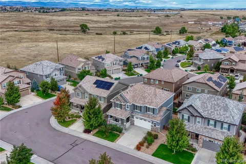 an aerial view of a house with a garden
