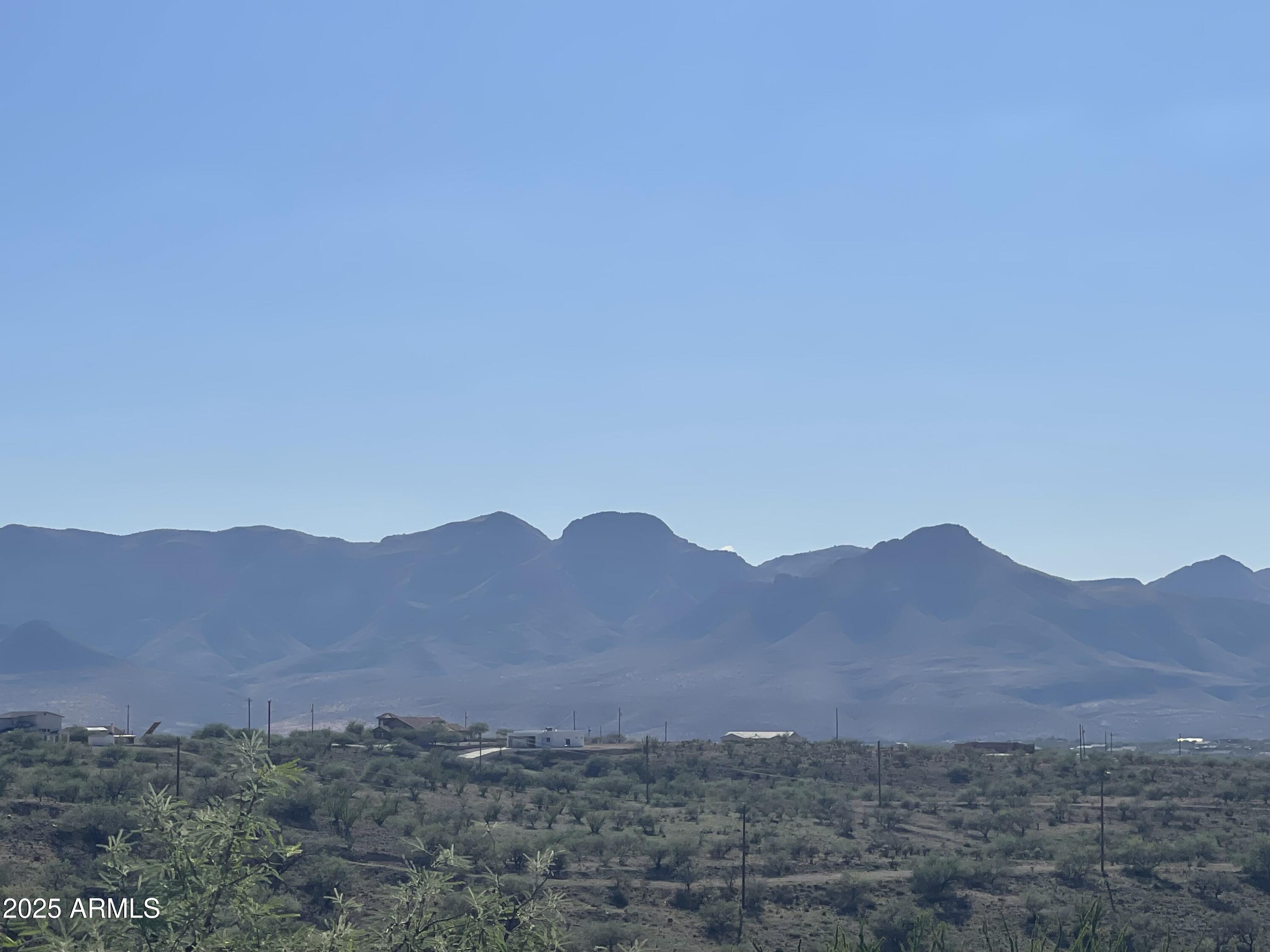 344 Anfibio Court, Unit 82 Rio Rico, AZ 85648 - Photo 7 of 9 a view of a mountain range with a lush green hillside