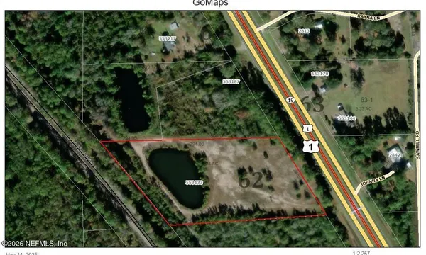 an aerial view of a residential houses with outdoor space