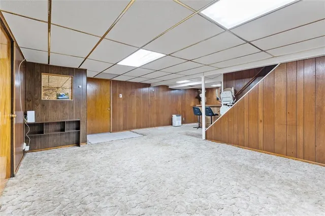 a view of empty room with wooden walls