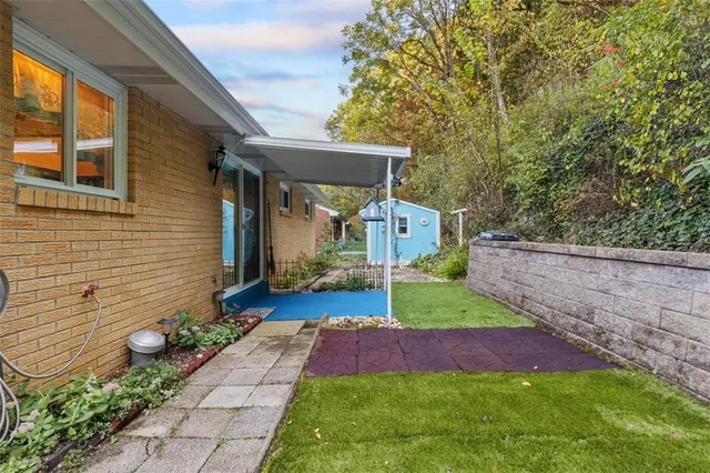 a front view of a house with garden