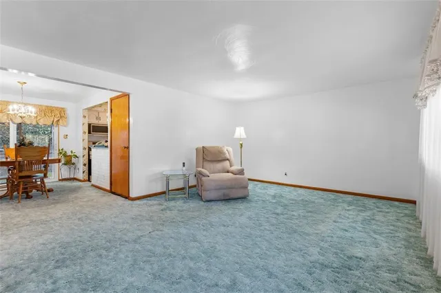 a room with furniture and a view of living room