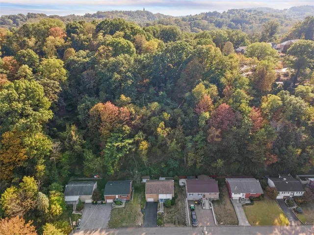 an aerial view of residential house with outdoor space