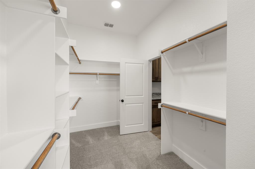 4867 Prairie Sky Lane DISH, TX 76247 - Photo 25 of 27 a view of walk in closet with empty racks