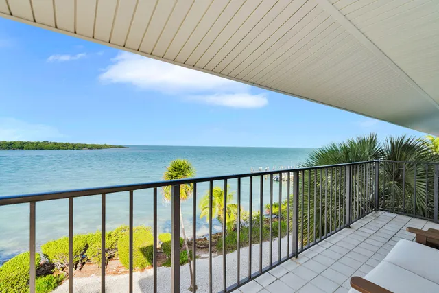 a balcony with wooden floor