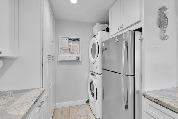 a view of a balcony with wooden floor and a lake view