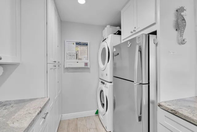 a bathroom with a granite countertop shower and a sink
