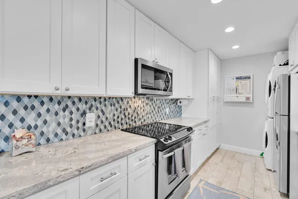 a bedroom with double bed and a chandelier