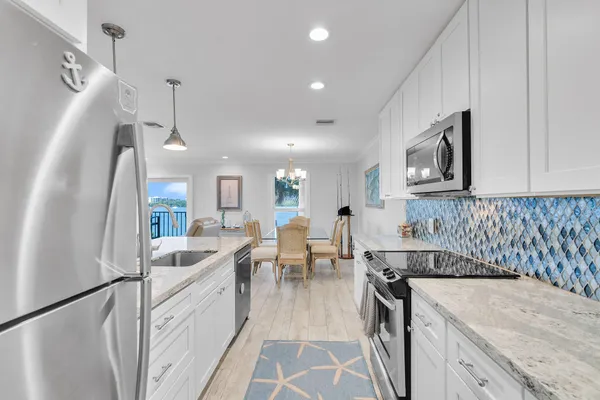 a bathroom with a double vanity sink mirror and