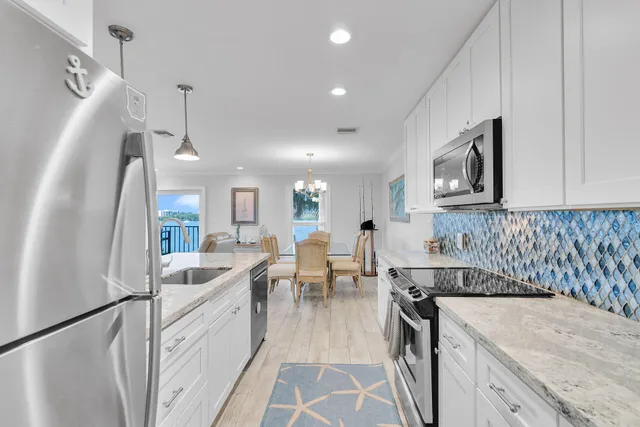 a kitchen with sink cabinets and stove