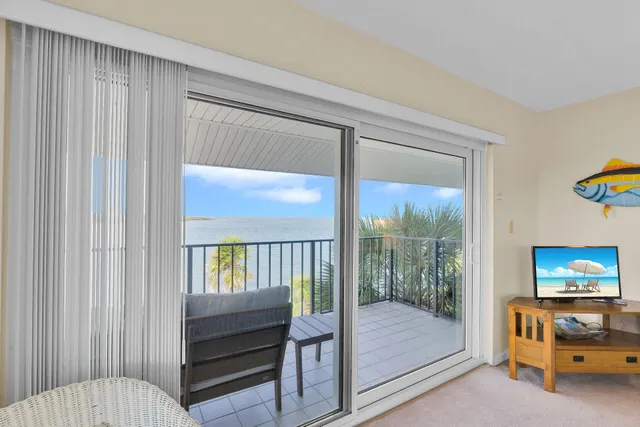 a bedroom with a bed and a view of bedroom