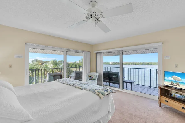 a bed room with a bed and a television