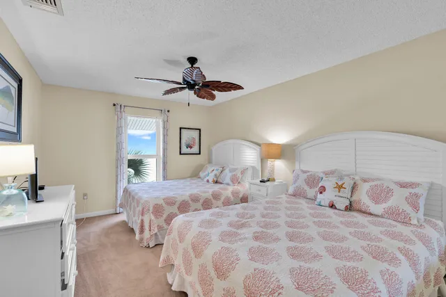 a bedroom with double bed and a chandelier