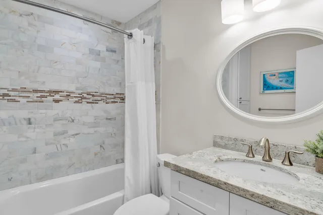 a bathroom with a double vanity sink mirror and